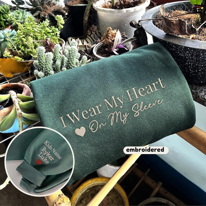 Embroidered I Wear My Heart On My Sleeve Sweatshirt, Custom Mama Sweatshirt with Kids Name on Sleeve, Christmas Mother Day Gift for Mom