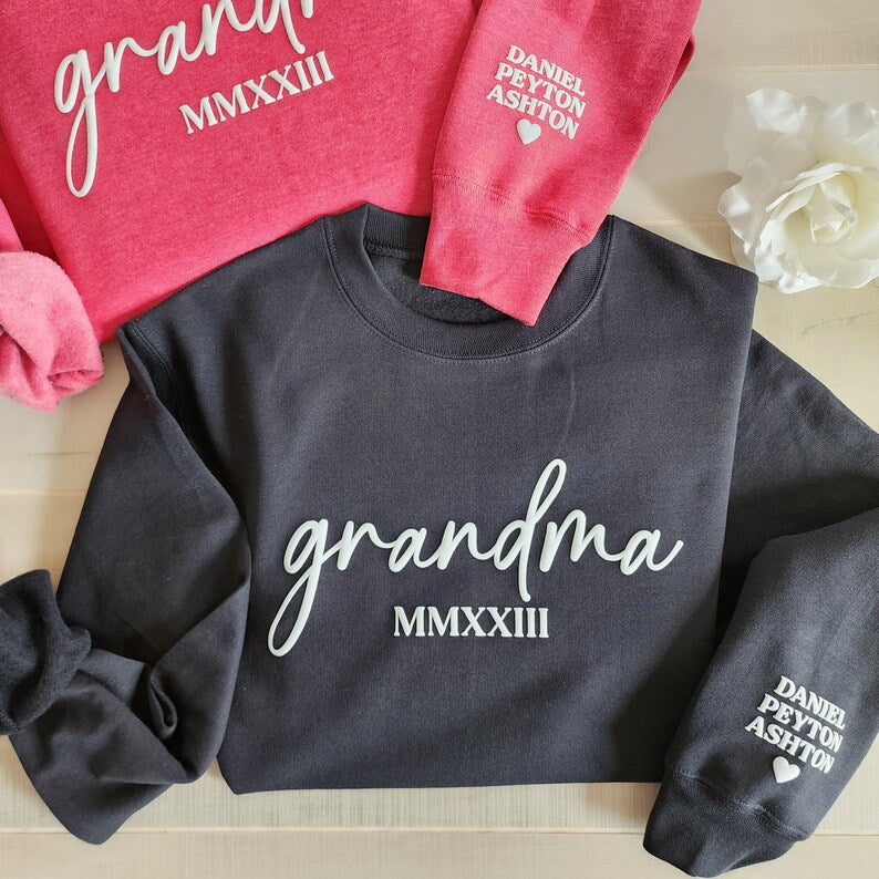 Custom Embossed Grandma Sweatshirt With Grandkids Names On Sleeve, Grandma Est Roman Numerals