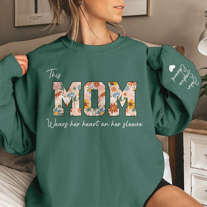 This Mom Wears Her Heart On Her Sleeve - Family Personalized Unisex Sweatshirt With Design On Sleeve - Birthday Gift For Mom, Grandma