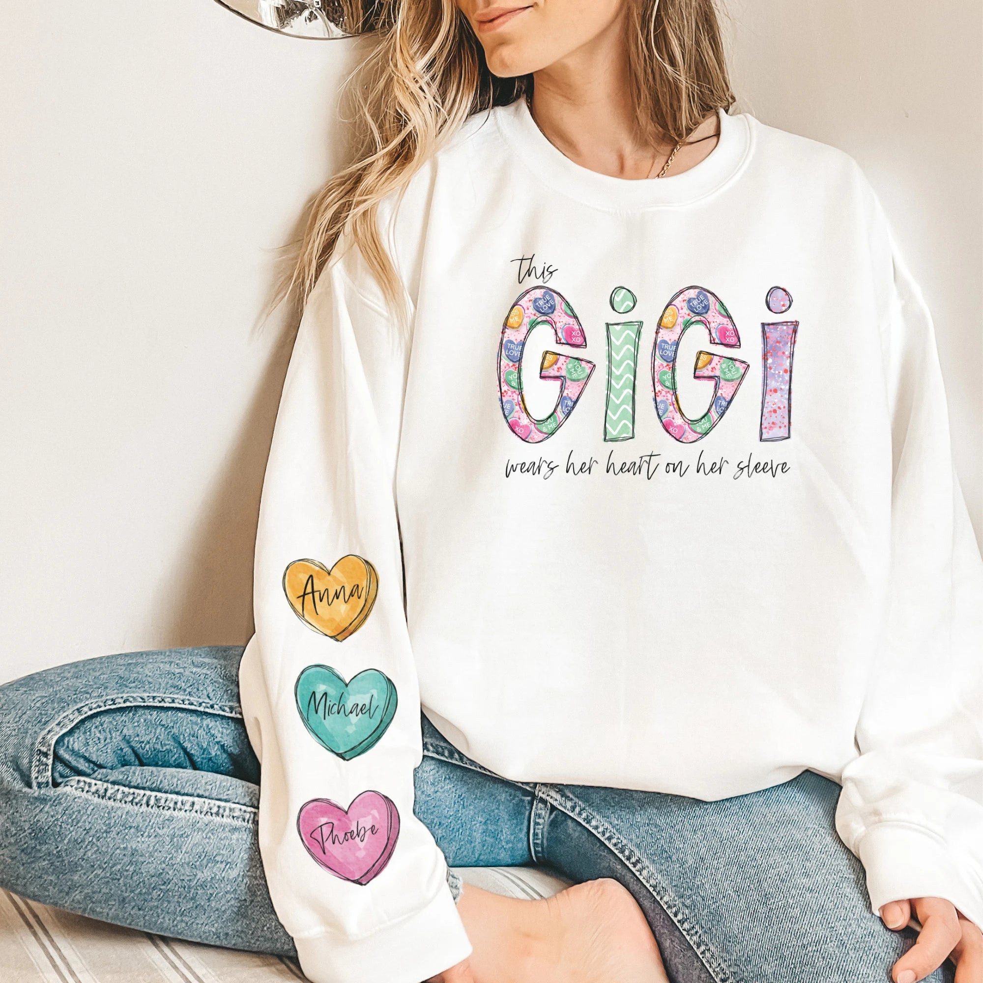 This GiGi Wears Her Heart On Her Sleeve Personalized Sweatshirt with Grandkids Names