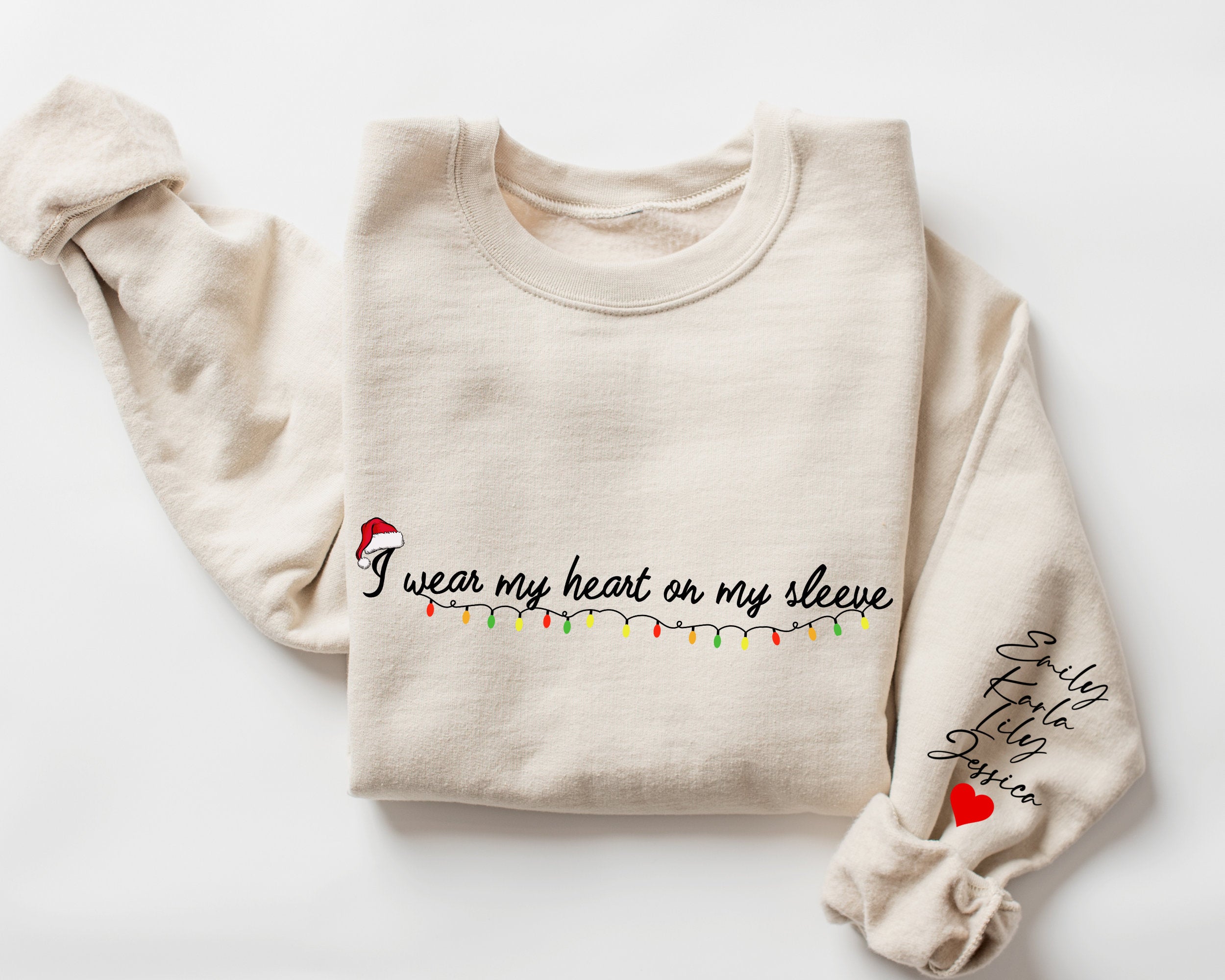 I Wear My Heart On My Sleeve Christmas Sweatshirt with Kids Names on Sleeve, New Mom Gift Personalized, Custom Gifts Mom Christmas