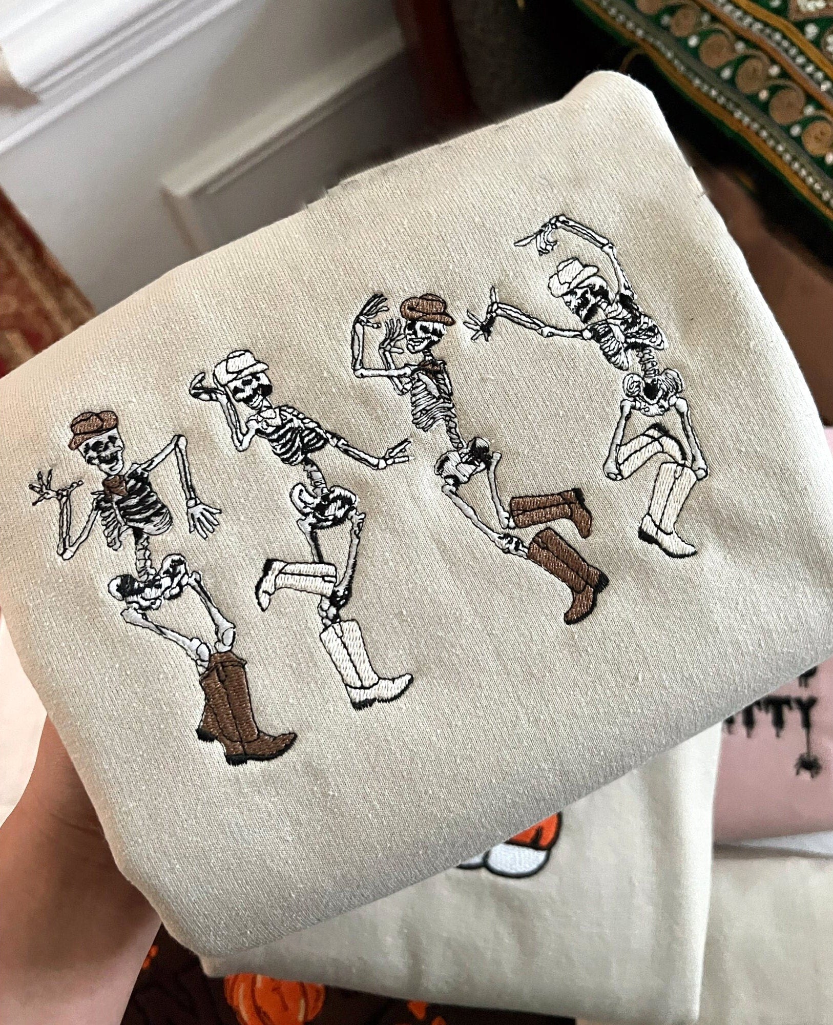 🎃🔥(Best seller)Cowboy Skeletons Sweatshirt Embroidered, Dainty Dancing Skeletons Sweatshirt, Spooky Season