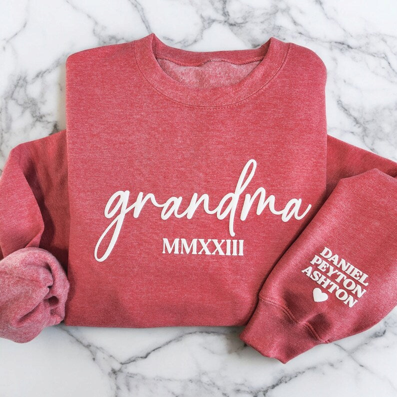Custom Embossed Grandma Sweatshirt With Grandkids Names On Sleeve, Grandma Est Roman Numerals